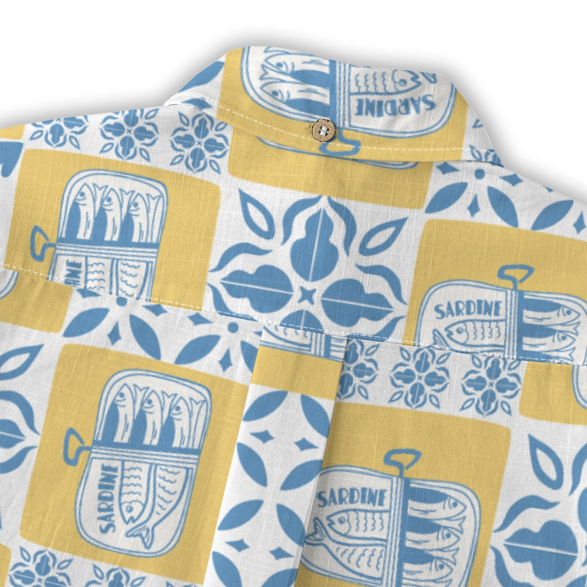 Close-up of the Sardine Shirt shoulder with vintage sardine tin print