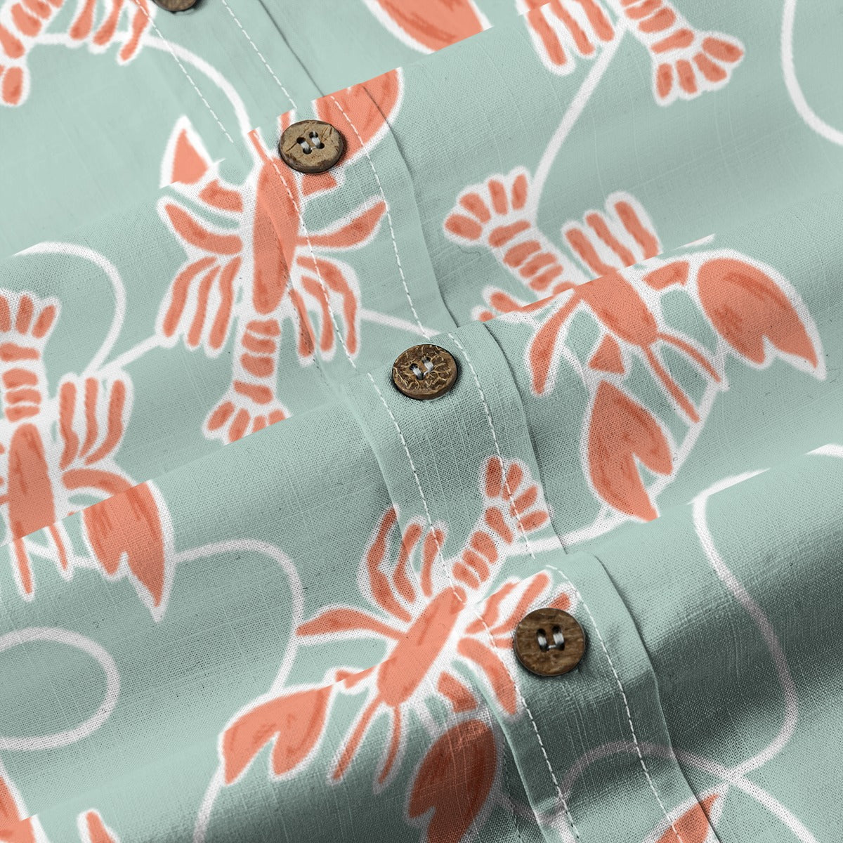 Close-up of the Lobster Fishing Shirt buttons with coral lobster print on sage green